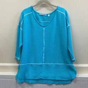 Sno Skins women’s size small turquoise slip on top